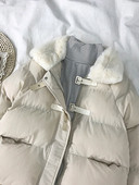 Női alkalmi kabát pehelytal és zsebekkel