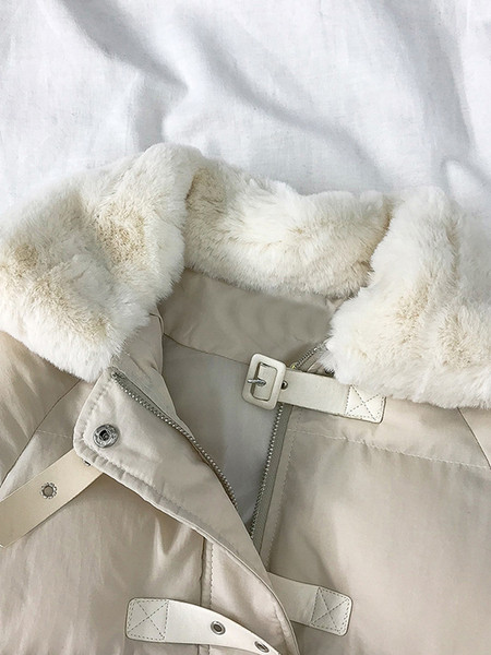 Női alkalmi kabát pehelytal és zsebekkel