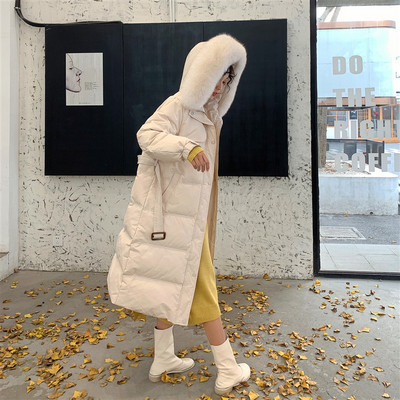 Χειμερινό μακρύ γυναικείο μπουφάν με γούνα και ζώνη