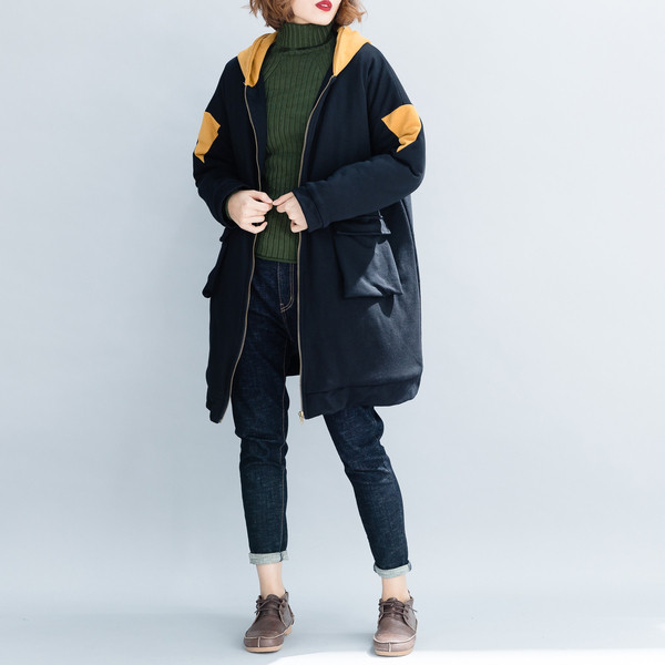 Női széles kabát kapucnival és cipzárral