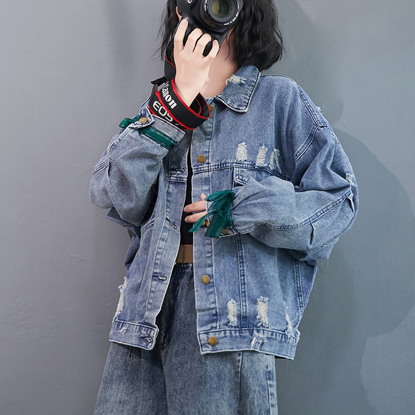 Naiste tikandi ja nööpidega teksajakk