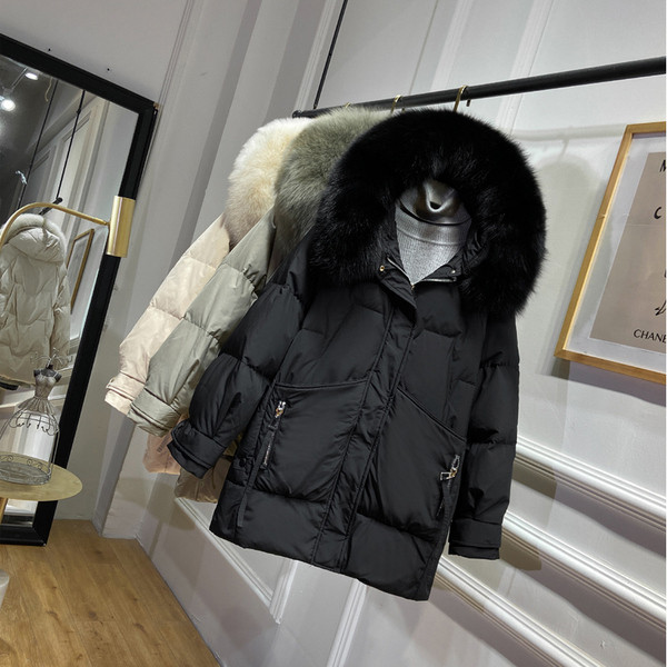 Naiste talvejope standardpikkusega ja kapuutsiga udusulega