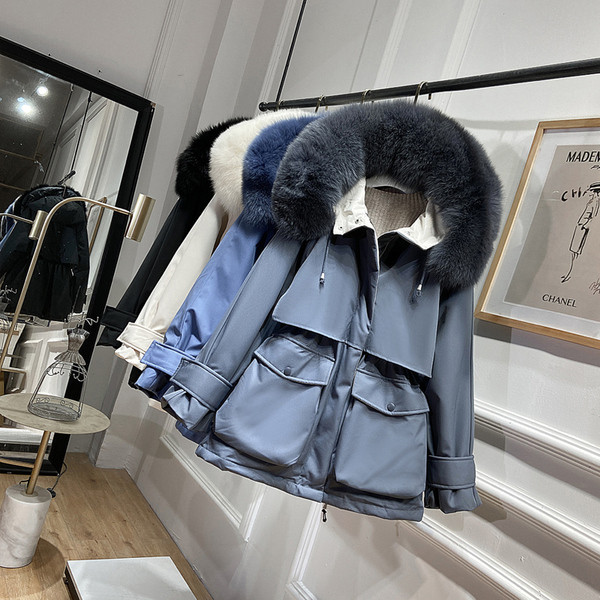 Jelenlegi női kabát kapucnival és pehellyel