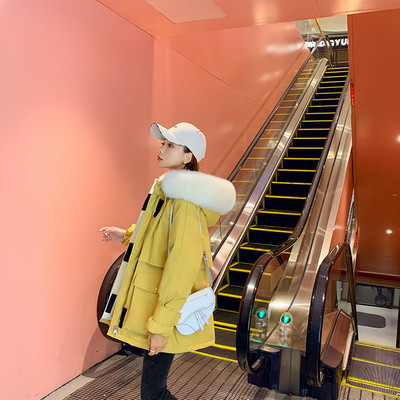 Naiste talvejope suurte taskute ja udusulega kapuutsiga