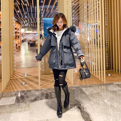 Naiste talvejope suurte taskute ja udusulega kapuutsiga