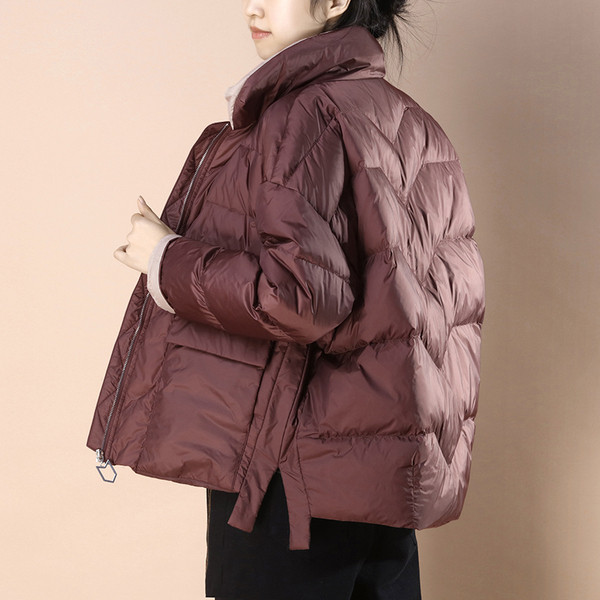 Széles modell téli kabát hasítékokkal