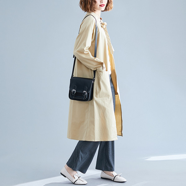 Dugačka ženska jakna - široki model sa džepovima