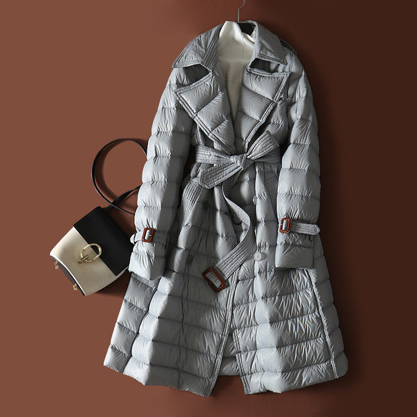 Pikk naiste veekindel jope vööga