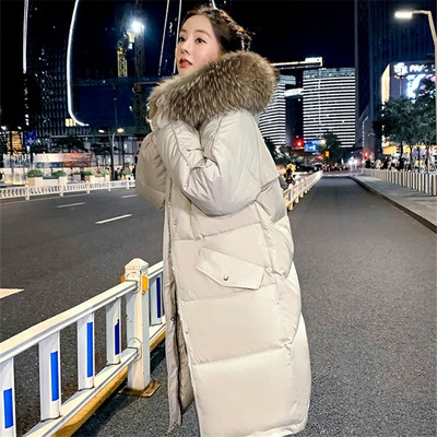 Pikk naiste talvejope kapuutsi ja taskutega