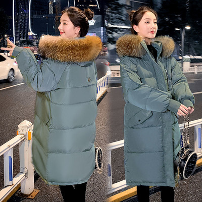 Pikk naiste talvejope kapuutsi ja taskutega