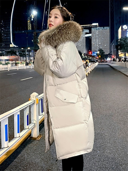 Pikk naiste talvejope kapuutsi ja taskutega