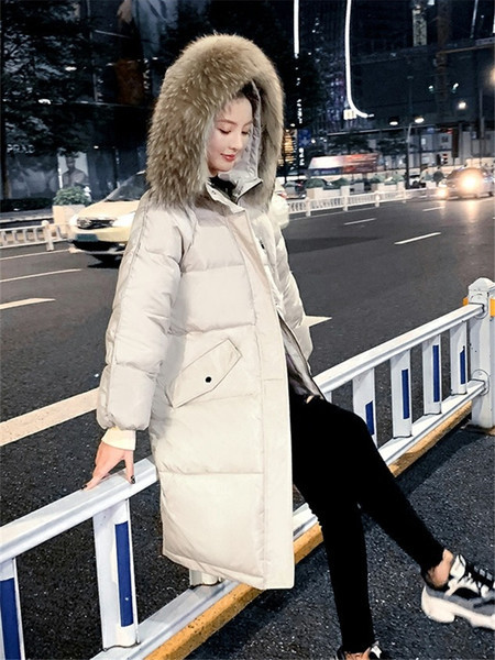 Pikk naiste talvejope kapuutsi ja taskutega