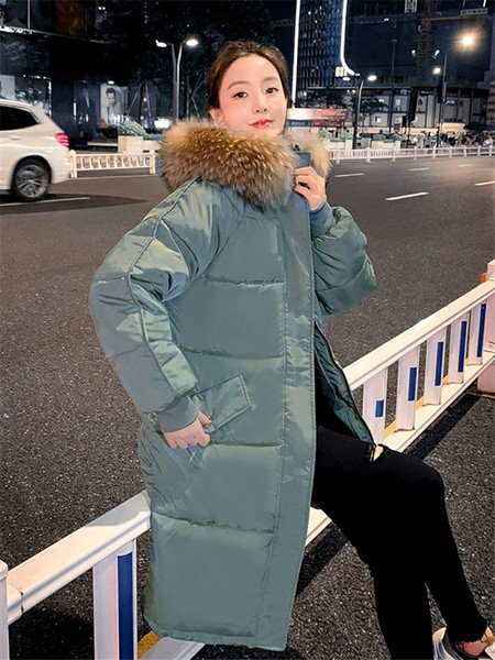 Pikk naiste talvejope kapuutsi ja taskutega