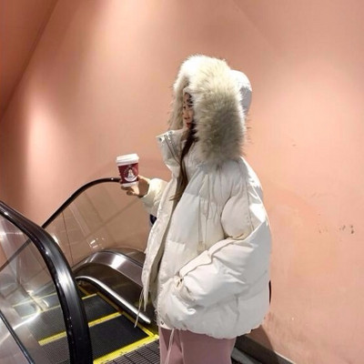 Φαρδύ μοντέλο χειμερινό γυναικείο μπουφάν με κουκούλα και γούνα