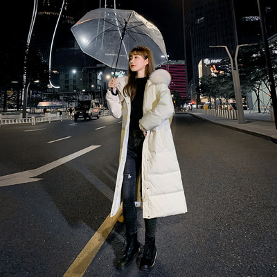 Pikk naiste talvejope kapuutsi ja taskutega