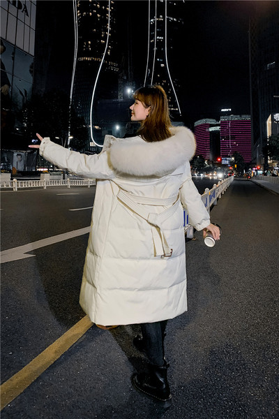 Pikk naiste talvejope kapuutsi ja taskutega