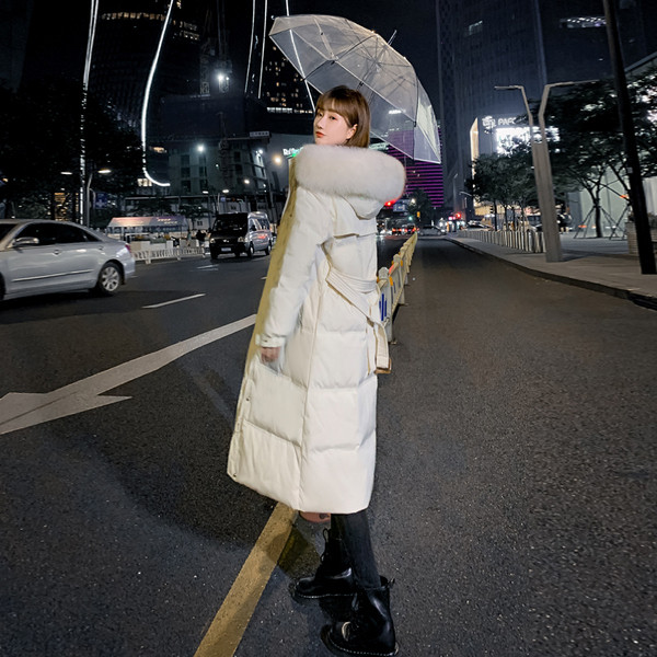 Pikk naiste talvejope kapuutsi ja taskutega