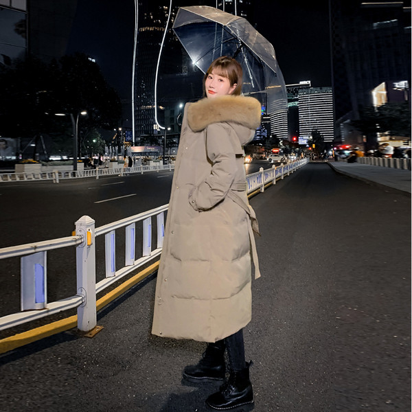 Pikk naiste talvejope kapuutsi ja taskutega