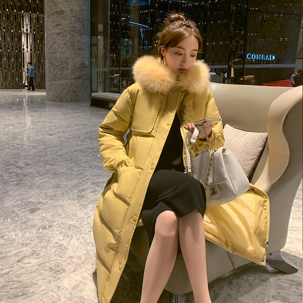 Γυναικείο μακρύ χειμερινό μπουφάν με ζώνη και κουμπιά