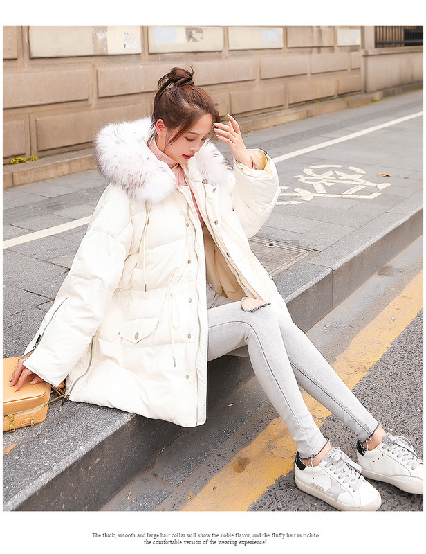 Modern női kabát elasztikus derékkal és kapucnival