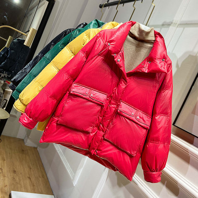 Naiste jope lai mudel kõrge krae ja taskutega