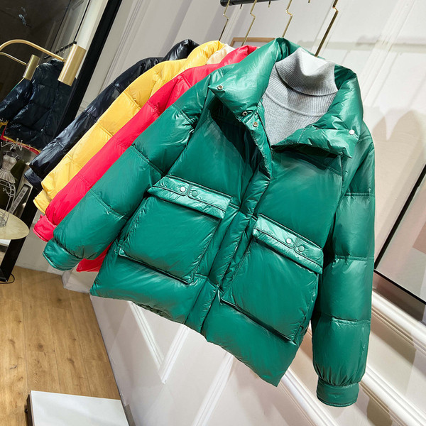 Naiste jope lai mudel kõrge krae ja taskutega