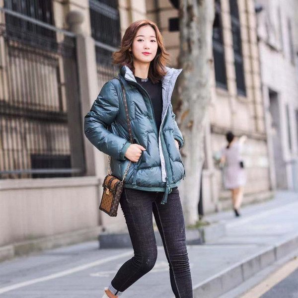 Naiste igapäevane kapuutsi ja lukuga talvejope