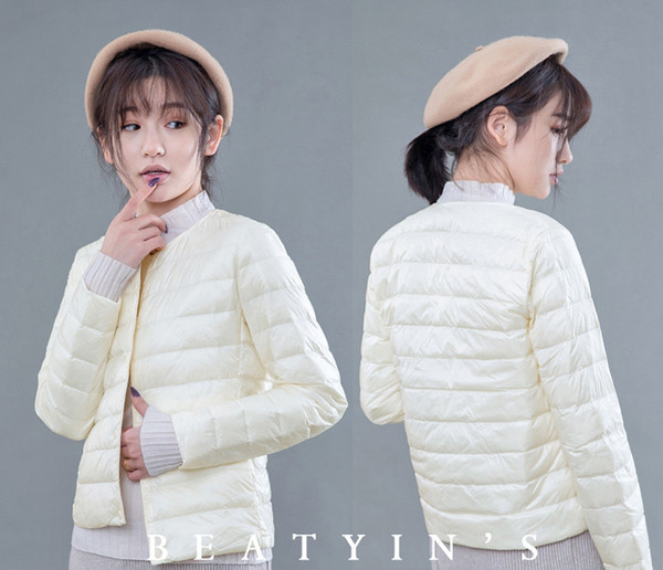 Rövid női kabát kerek nyakkivágással és gombokkal