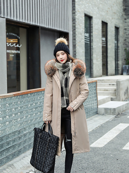 Pehme voodriga naiste talvejope, kapuutsil värviline suleosa