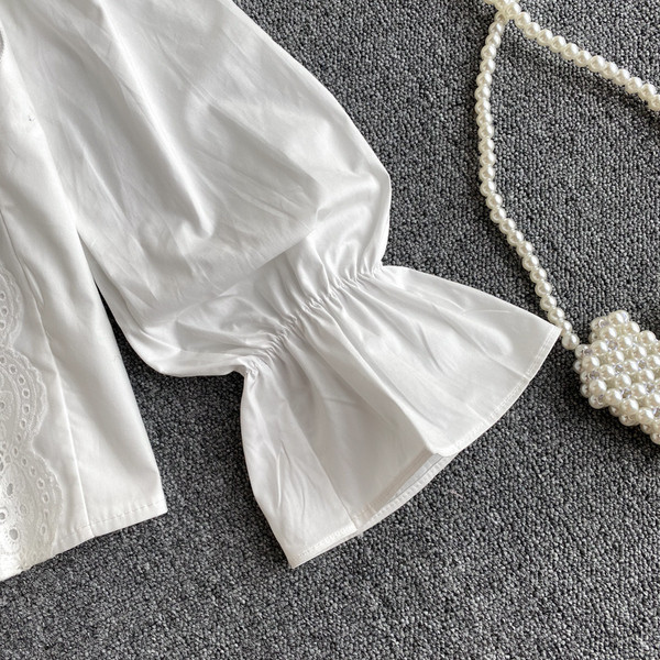 Női ing kerek nyakkivágással, csipkével és fürtökkel - fehér színű